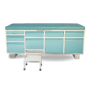 green colored full examination couch